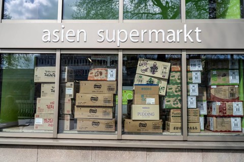 Shop window of an Asian supermarket, for food, full of packaging