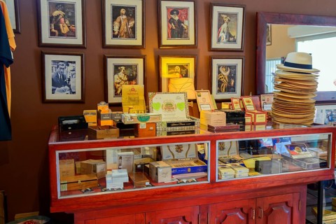 Sale of cigars in a room with portraits and traditional furniture, Bayahibe, Dominican Republic,