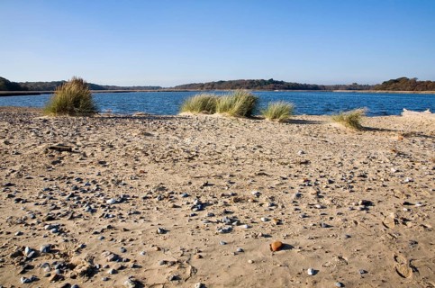 Benacre Broad lake is separated from the sea by the shingle beach bar of Benacre Ness, Suffolk,