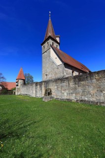 Small Easter fountain in front of the fortified church from the Middle Ages, fortified church,