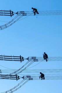 Overhead line fitters working on a high-voltage pylon, overhead lines, energy, worker, high-voltage