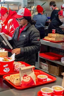 Sterling Heights, Michigan, Workers serve up Chickenjoy fried chicken at Jollibee, a Filipino fast