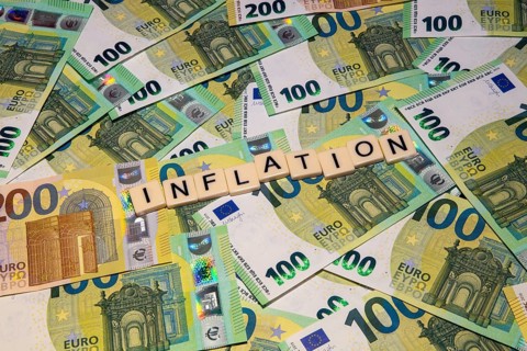 Symbolic image of inflation: letters on euro notes show the word inflation