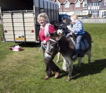 Seaside donkey rides reappear after a gap of fifty years at Felixstowe, Suffolk, England, UK 2010