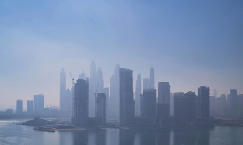 Morning fog, skyline with Princess Tower, Elite Residence, luxury yacht OPERA owned by Sheikh