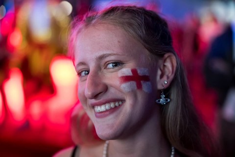 Fan of the English team with a flag on his cheek at the Adidas fan zone at the Bundestag during the