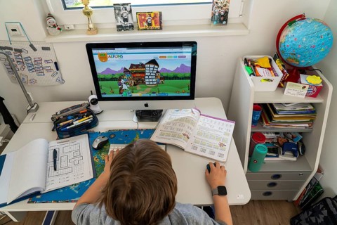 Young, primary school pupils, home learning, doing schoolwork, distance learning, virtual