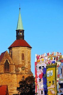 Magnikirche next to the Happy Rizzi House by the artist James Rizzi, architectural contrast,