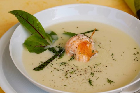 Southern German cuisine, sorrel soup with char, freshwater fish, soup arranged in a plate, herbs,