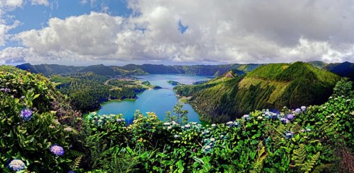 Picturesque panoramic view of the crater lakes Lagoa Verde and Lagoa Azul surrounded by green