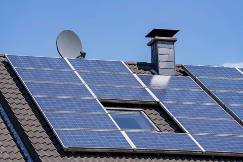 Solar system on the pitched roof of a residential building, photovoltaics for power generation, for