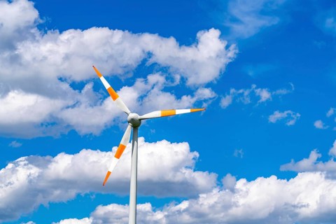 Wind turbine, wind energy plant from the manufacturer Enercon, blue sky with many white clouds,