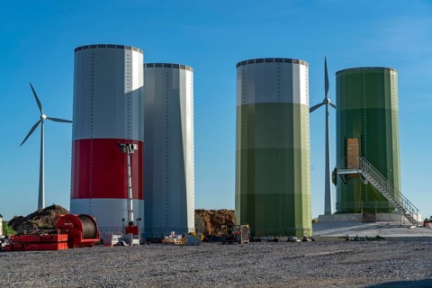 Construction site of a new wind turbine, modules of the tower, wind turbine from the manufacturer