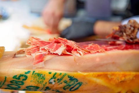 Famous street market near Barcelona Cathedral in Las Ramblas, Jamon Serrano preparation stand