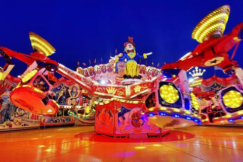 The illuminated carousel Circus Circus in the evening, Cranger Kirmes, Herne, Ruhr area, North