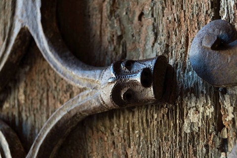 Orcival. Intricate Roman wrought iron hinge displayed at the Basilica Notre-Dame d'Orcival, Puy de