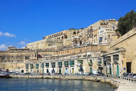 Historic waterfront buildings on Grand Harbour waterside, Valletta, Malta, Europe