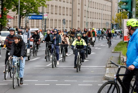 A policewoman from the Berlin bicycle squadron accompanies the bike parade demonstration, Berlin,