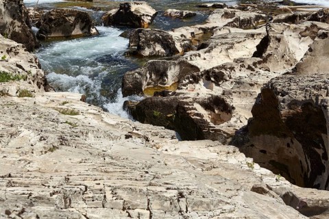 The river Cèze and limestone cliffs form the cascades of Sautadet near La Roque-sur-Cèze,