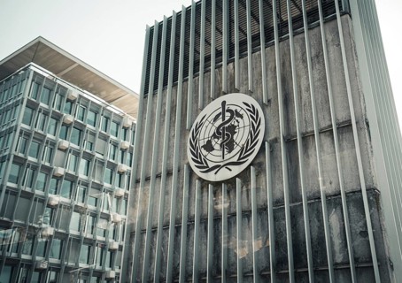 View of the logo of the World Health Organisation (WHO) on a building at its headquarters in Geneva