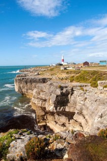 Red and white lighthouse on the coast at Portland Bill, Isle of Portland, Dorset, England, United
