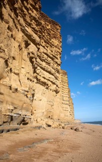 Sandstone cliffs and beach West Bay, Bridport, Dorset, England, UK