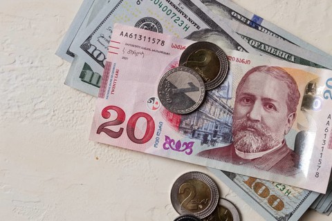 Lari, 20 GEL, Georgian monetary currency, with dollars, banknotes, top view, no people, on the