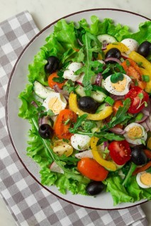 Vegetable salad, with quail eggs and olives, fresh, close-up, no people