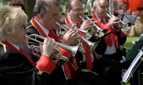 Musicians in a brass band perform during a country fair at Helmingham Hall, Suffolk, England,