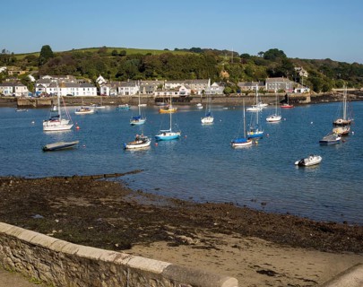 Yachts at moorings on River Fal, Flushing, Cornwall, England, UK