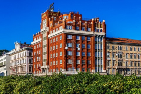 Art Deco building Palazzo Aedes or Palazzo Rosso, waterfront promenade, Trieste, harbour town on