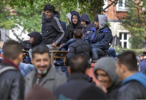 Refugees from Syria waiting to be registered at the Central Reception Centre for Asylum Seekers at