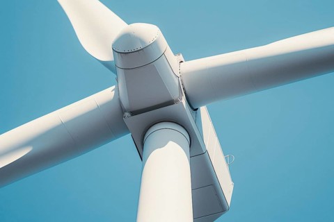Center of wind mill turbine in front of blue sky. Generative Ai, AI generated