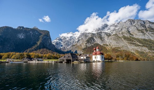 Königssee with Watzmann massif and pilgrimage church St. Bartholomä, autumnal mountain landscape,