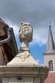 Vase attachment on a courtyard gate, 1774, behind the tower of the parish church of St John the