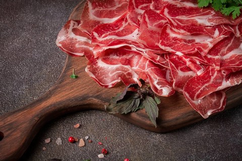 Sliced cured ham, prosciutto, italian dish, delicacy, parma ham, top view, no people