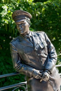 Bronze statue, monument to rock singer Elvis Presley, King of Rock 'n' Roll in uniform of the 3rd