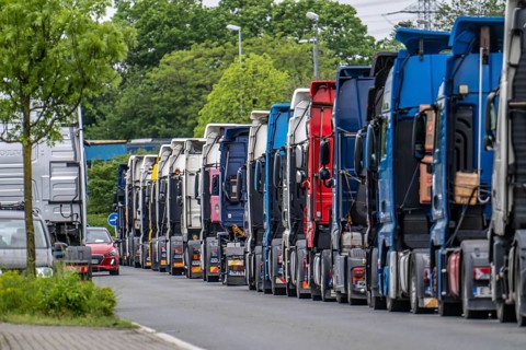 Truck tractors, exclusively from Eastern European countries, park in the harbour area, the canal