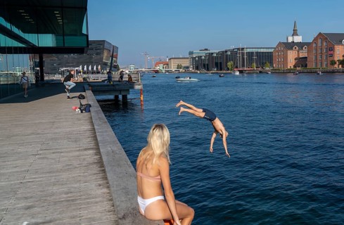 Summer, swimming in the harbour of Copenhagen, there are official bathing places, harbour baths and