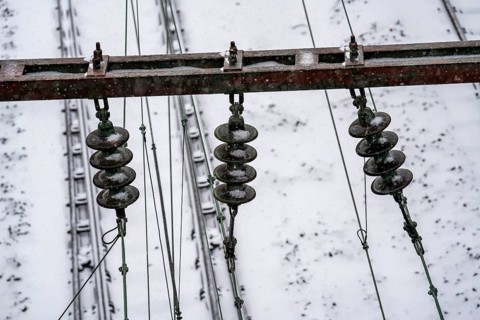 Onset of winter with lots of fresh snow and temperatures below -5 degrees during the day, railway