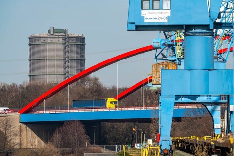 Gasometer of the Prosperität coking plant in Bottrop, cranes in Essen city harbour, motorway bridge