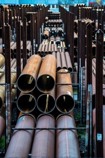 Warehouse for steel pipes in Duisburg harbour, steel pipes in various diameters, North