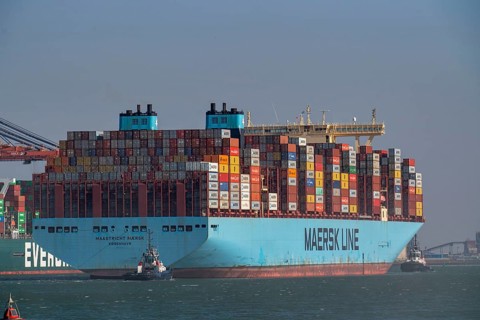 Container ship of the shipping company Maersk Line, Maastricht Maersk, leaving the harbour, towed