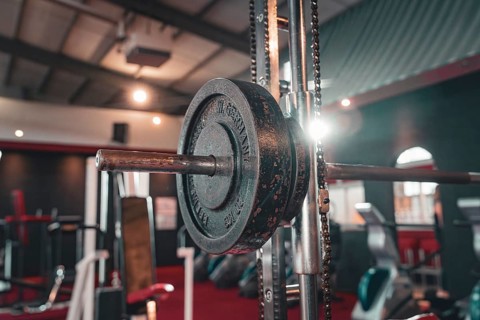 Dumbbell bar with weight in the centre of a fitness room, Historic Fitness Studio, Bulls Fit,