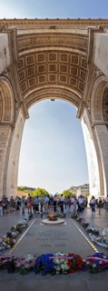 Tourists gather under the Arc de Triomphe to commemorate Paris, Paris