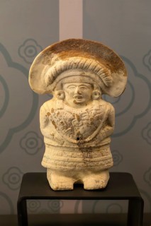Figurine model of woman in embroidered outfit, from Jaina, Late classical period, Mayan