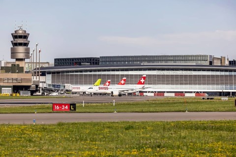 Swiss airline aircraft at Zurich Airport. Terminal and tower. Zurich, Switzerland, Europe