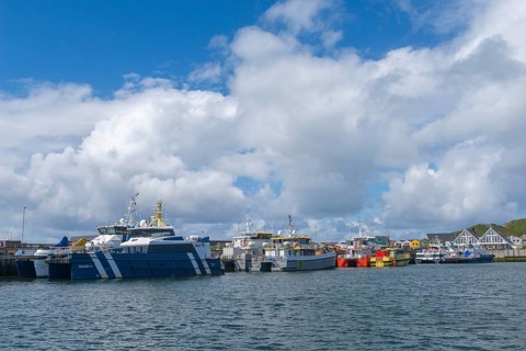 Supply ships for the wind power off-shore plants, catamarans, offshore island of Helgoland, blue