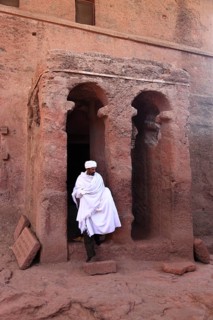 Rock churches of Lalibela, entrance to St Mary's Church and pilgrims, Bete Maryam, Ethiopia, Africa