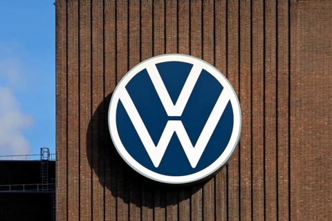 Large VW logo on the old cogeneration plant, Volkswagenwerk Wolfsburg, main plant of Volkswagen AG,